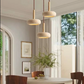 Lampe de chevet suspendue Wabi-Sabi en travertin vue de profil, design minimaliste inspiré du style japonais pour chambre moderne